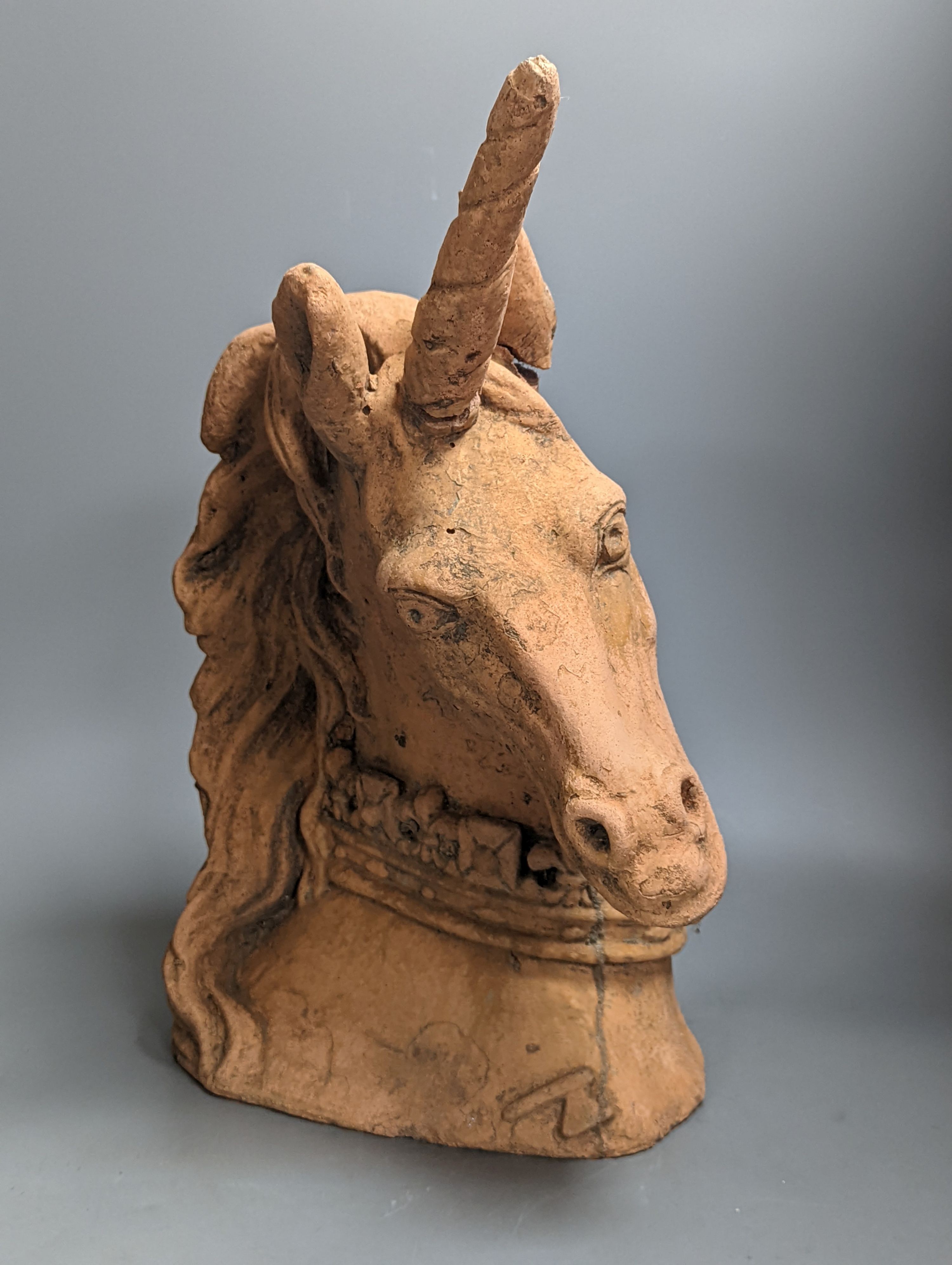 A Terracotta model of a unicorn head 45cm